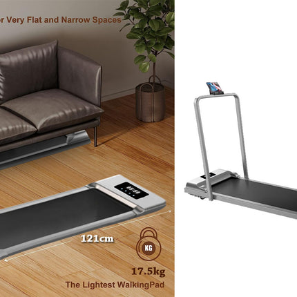 Portable treadmill on a wooden floor with sofa and plant in the background