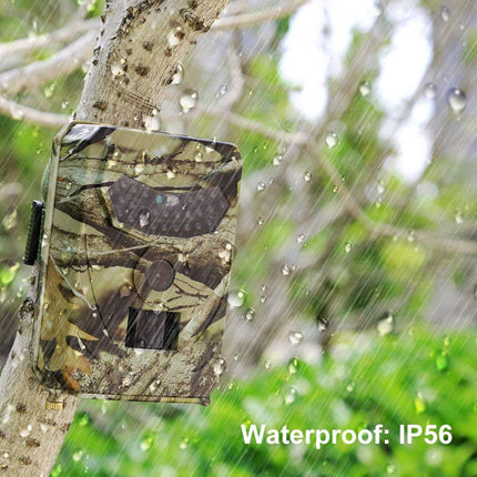 Camouflage trail camera on a tree with raindrops, labeled 'Waterproof: IP56'.