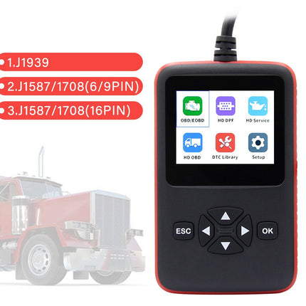 Car diagnostic tool with display and buttons, truck in the background