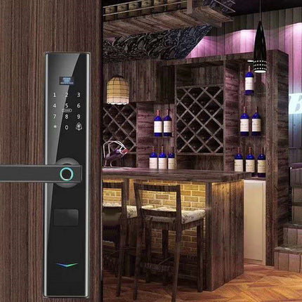 Digital door lock on a wooden door with a bar interior in the background