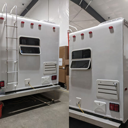 A white travel trailer or RV shown from the rear and side in a warehouse or showroom setting, with a metal ladder on the back, windows, vent grilles, and red taillights.