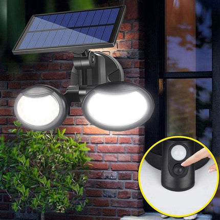 Solar-powered outdoor light fixture on a brick wall with a close-up of the sensor.