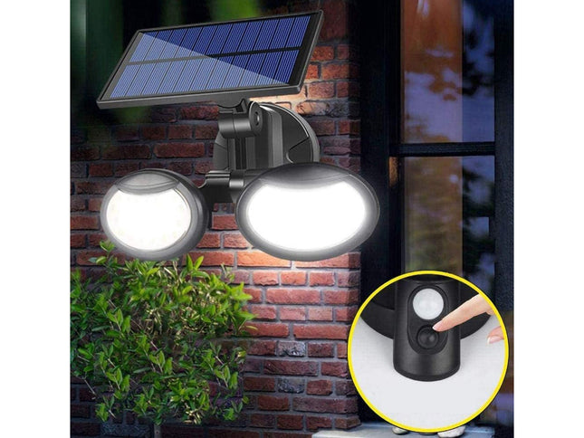 Solar-powered outdoor light fixture on a brick wall with a close-up of the sensor.