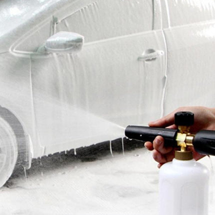 Person washing a car with a foam cannon