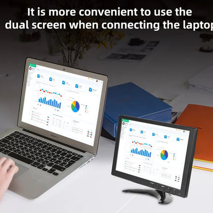 Laptop with dual screen displaying financial data on a desk.