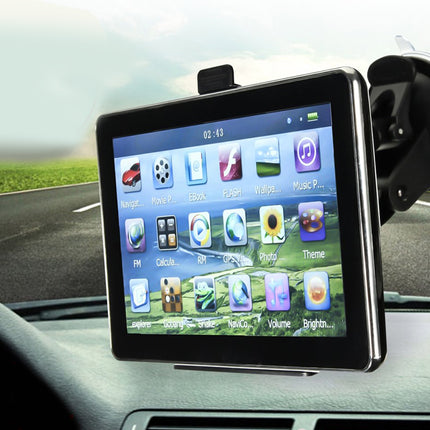 GPS device on a car dashboard with a road visible through the windshield