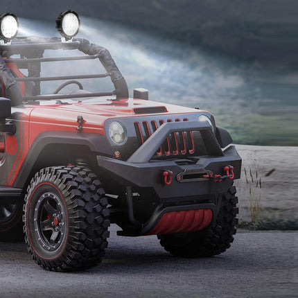 Red off-road vehicle with large headlights on a rocky terrain
