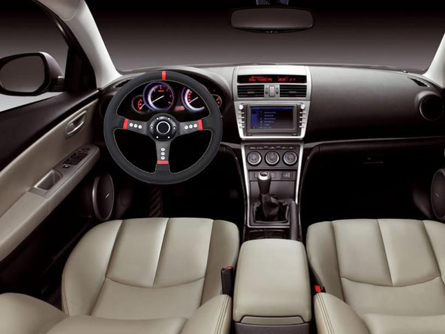 A car interior with beige leather front seats, a black steering wheel with red accents, a dark dashboard, and a center console with an infotainment screen.