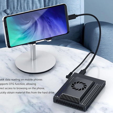 Phone screen magnifier with cooling fan on a marble surface