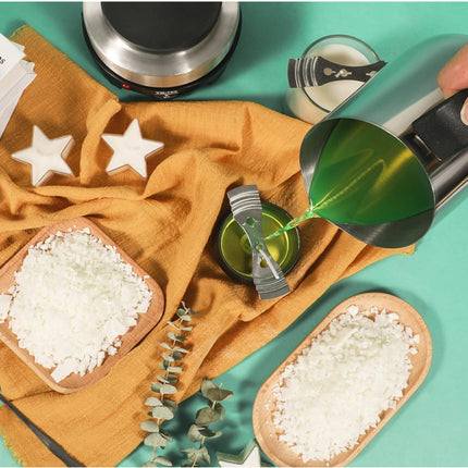 Person pouring a green liquid into a small container on a teal surface with star decorations.