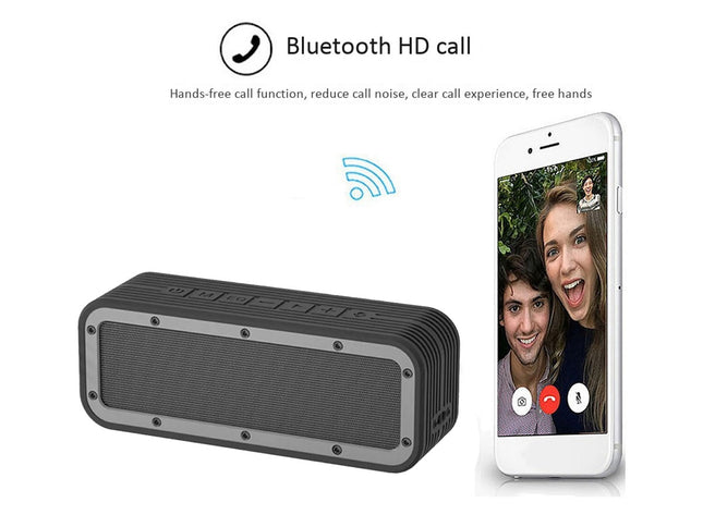 Black Bluetooth speaker with smartphone displaying a video call on a white background