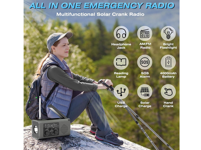 An outdoor promotional graphic for a multifunctional solar crank radio. A woman in a cap and vest sits on a rock in a forest, holding a walkie-talkie, while a portable gray radio with an antenna is shown in the lower left.