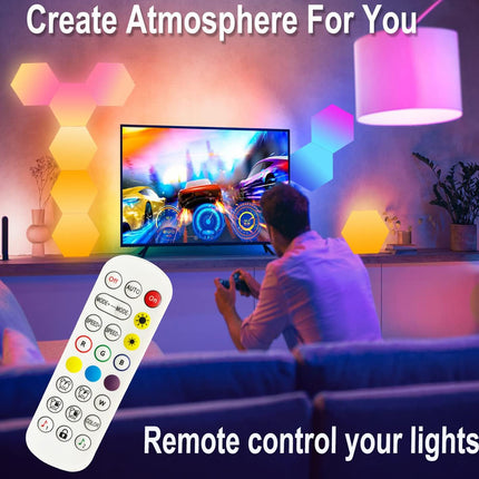 A promotional graphic showing a person sitting in a living room, facing a TV, with colorful hexagonal wall lights glowing in pink, yellow, and blue. A large remote control is overlaid in the foreground, with text reading 'Create Atmosphere For You' and 'Remote control your lights'.