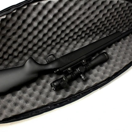 Black rifle with scope in a foam-lined case on a white background