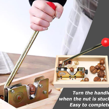 Hand using a tool to open nuts with a wooden box containing nuts on a table.