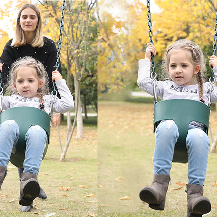 Two children on swings in a park with trees and grass in the background.