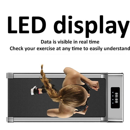 Person using a treadmill with an LED display showing real-time exercise data.