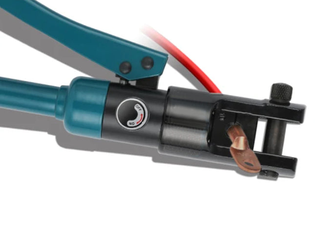 A close-up of a hydraulic crimping tool with teal handles, a black body, a red cable, and a copper contact tip, shown on a white background.