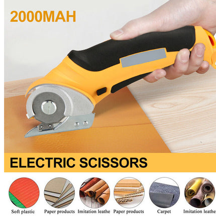 A hand holding a yellow and black electric circular saw cutter over a light wood surface, with text reading '2000MAH' and 'ELECTRIC SCISSORS' and small material icons along the bottom.
