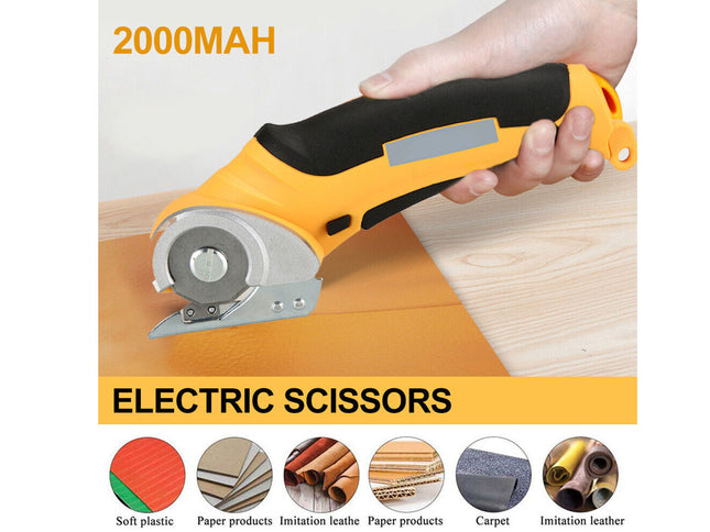 A hand holding a yellow and black electric circular saw cutter over a light wood surface, with text reading '2000MAH' and 'ELECTRIC SCISSORS' and small material icons along the bottom.