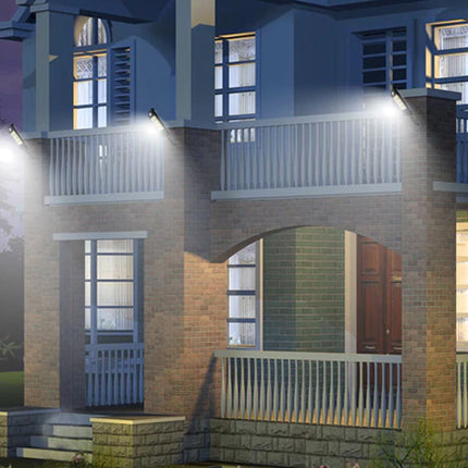 Two-story house with lit windows at night