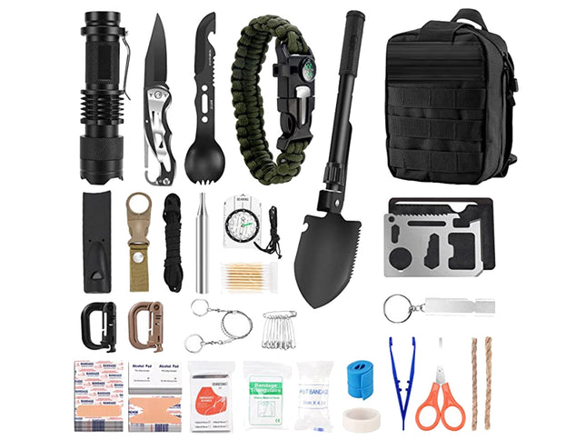 A comprehensive emergency survival kit laid out on a white background, featuring a black tactical flashlight, folding knife, paracord bracelet, black tactical backpack, black shovel, multi-tool card, shears, tape, fire starter, and first aid supplies.