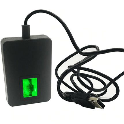 Black electronic device with a green display and USB cable on a white background