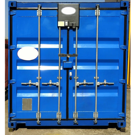 A blue industrial shipping container with double doors, featuring silver metal locking bars, hinges, and a central black electronic lockbox with a circular light.
