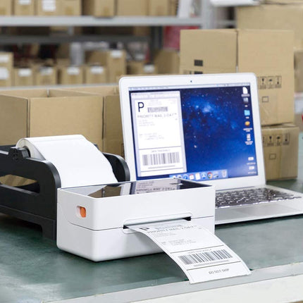 Label printer producing a label with a laptop in a warehouse setting
