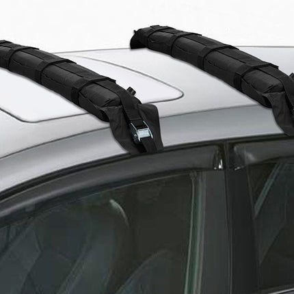 Two black roof racks on a car