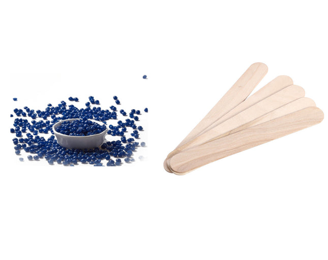 Blue pellets in a bowl next to wooden sticks on a white background