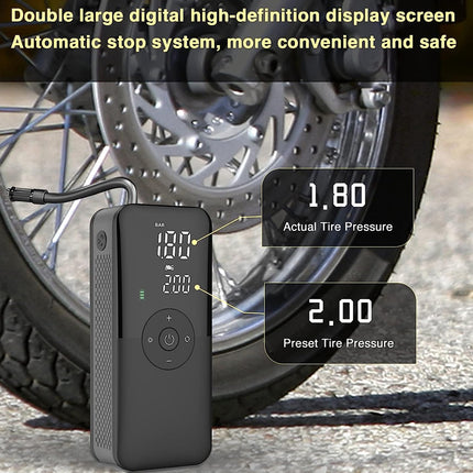 A black digital motorcycle tire pump shown in front of a motorcycle wheel, with text callouts displaying actual tire pressure 1.80 and preset tire pressure 2.