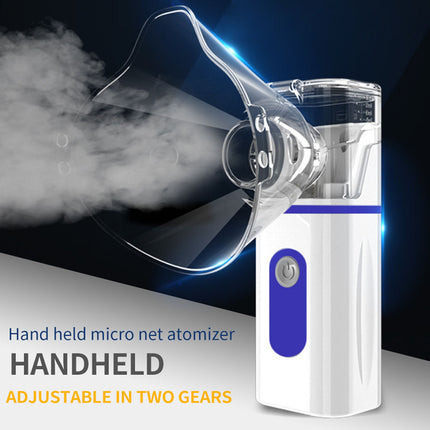 Handheld micro nebulizer with steam emanating from it on a dark background