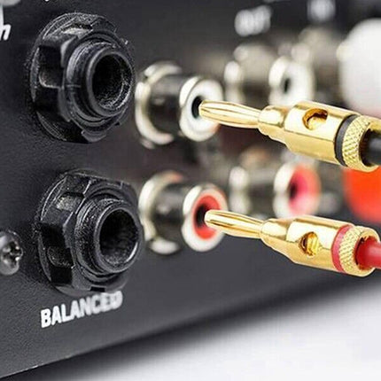 Audio cable connectors being plugged into a audio equipment unit with 'BALANCED' label.