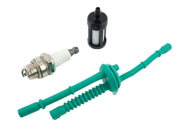 Set of automotive spark plug, fuel filter, and green hose on a white background