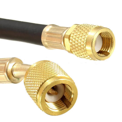 Close-up of two gold metal RF connectors on a black cable, shown against a plain white background.