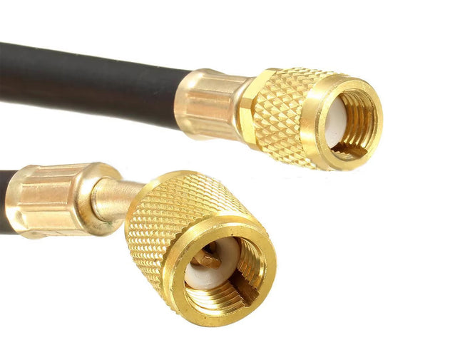 Close-up of two gold metal RF connectors on a black cable, shown against a plain white background.