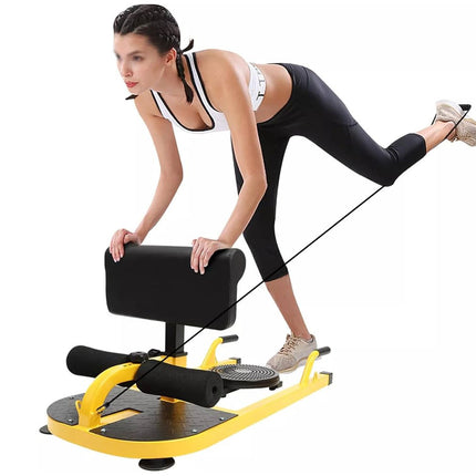 Woman exercising on a yellow and black exercise device against a white background