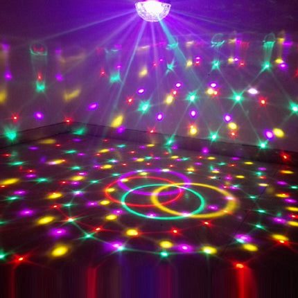 Colorful disco lights on a dark floor with a projector