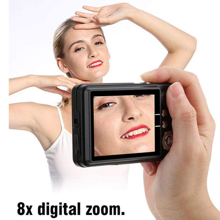 Person using a camera with a screen displaying a close-up of another person's face, emphasizing 8x digital zoom feature.