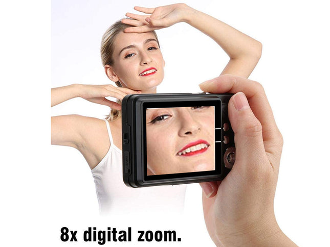 Person using a camera with a screen displaying a close-up of another person's face, emphasizing 8x digital zoom feature.