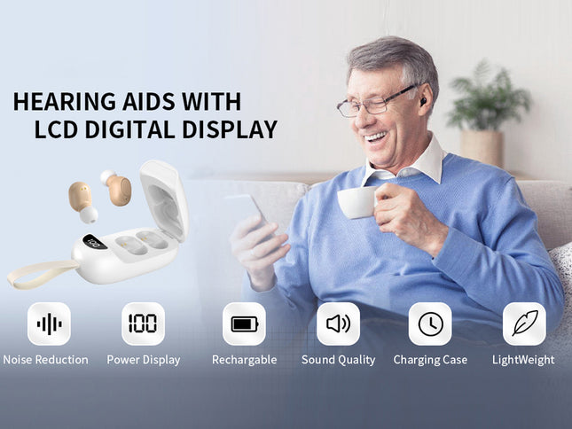 Man using hearing aids with LCD digital display, sitting on a couch with a cup.