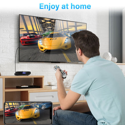Person playing a racing game on a TV and smartphone in a living room.
