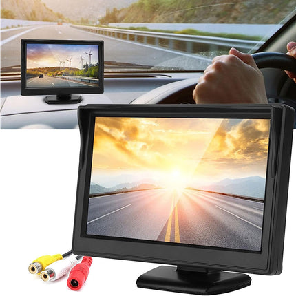 Car dashboard with a mounted monitor displaying a scenic road, with a person driving.