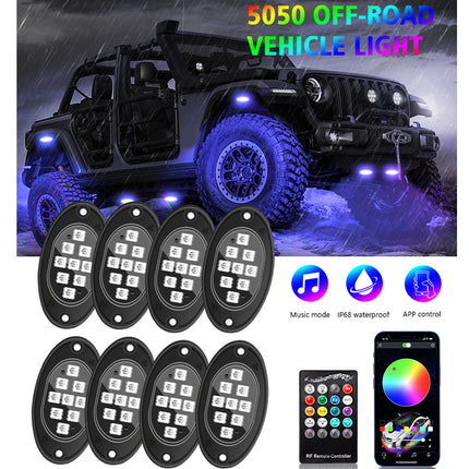 Six oval black vehicle LED light modules shown with a remote control and a smartphone app screen, plus a large inset photo of an off-road vehicle with blue underglow. Text at the top reads '5050 OFF-ROAD VEHICLE LIGHT' and feature icons mention music mode, IP65 waterproof, and APP control.