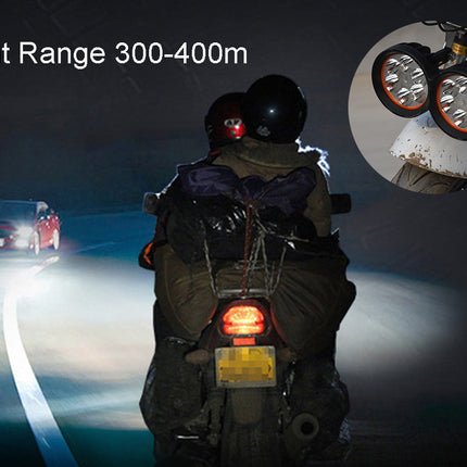 Motorcycle on a dark road with headlights on, showing light range of 300-400 meters.