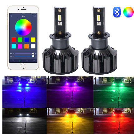 Two black LED car light bulbs shown on a white background, alongside a smartphone app screen displaying a color picker, Bluetooth and Wi-Fi icons, and six nighttime road scene thumbnails showing the light beams in blue, purple, green, yellow, white, and red.