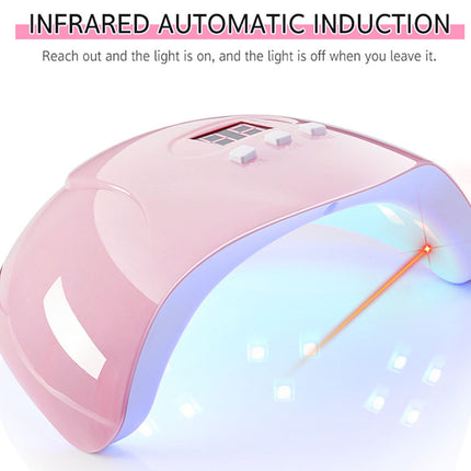 Pink UV LED nail lamp with a digital display and buttons on top, emitting blue light inside and showing an orange laser beam, with text at the top reading 'INFRARED AUTOMATIC INDUCTION'.