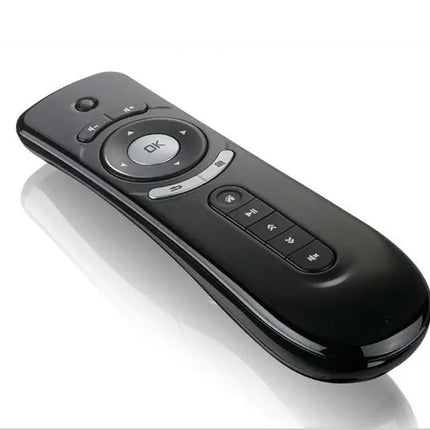 Black remote control on a white background
