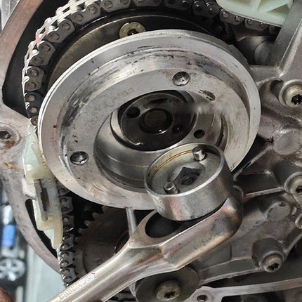 Close-up of mechanical engine components with a blurred background